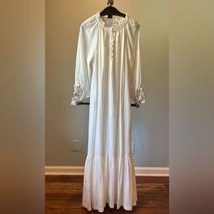 Cleobella white maxi dress with tassel and sea shell accents on sleeve.